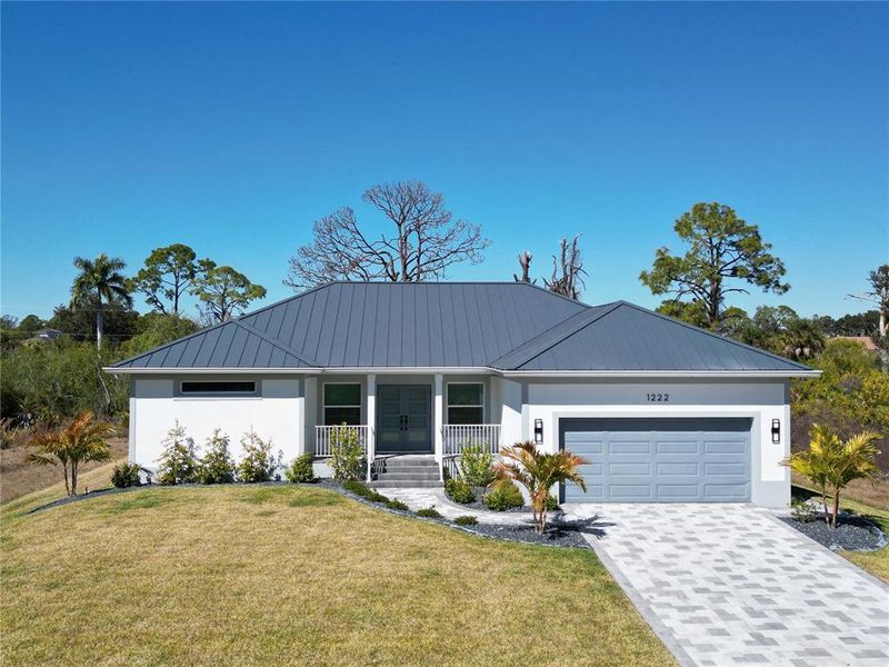 Front exterior of a new home in , Port Charlotte, FL, highlighting curb appeal (Image 2). Front exterior of a new home in , Port Charlotte, FL, highlighting curb appeal (Image 2).
