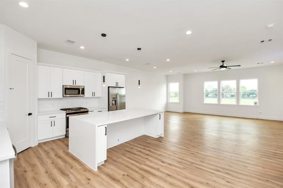 View from the kitchen overlooking the family room and dining room areas!