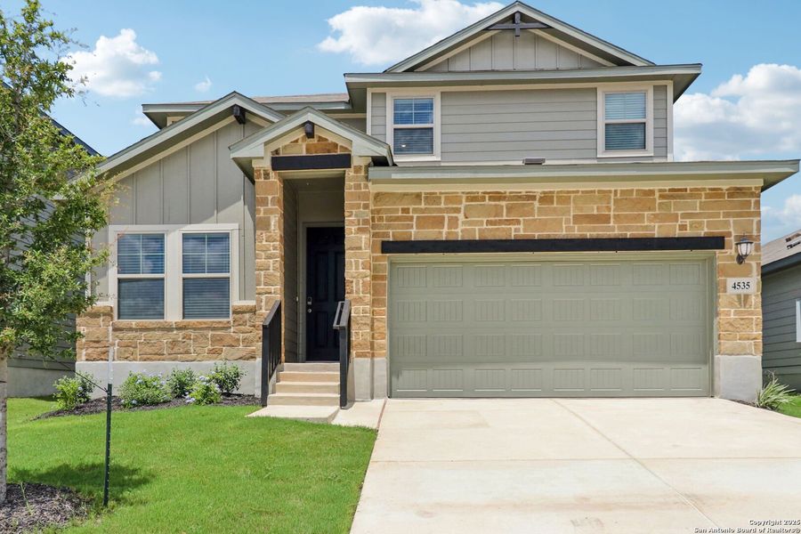 Front exterior of a new home in Remington Ranch, San Antonio, TX, highlighting curb appeal (Image 22). Front exterior of a new home in Remington Ranch, San Antonio, TX, highlighting curb appeal (Image 22).