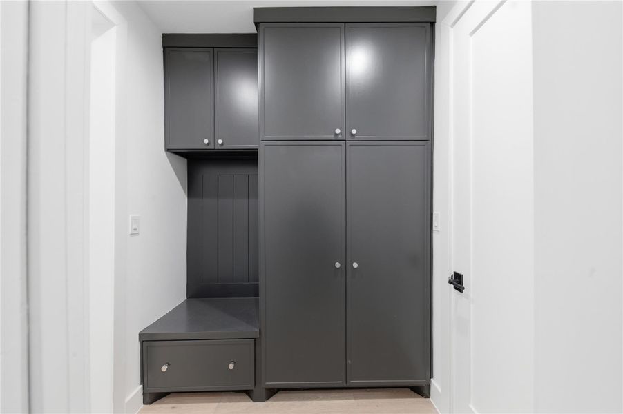 Keep everyday essentials organized in this thoughtfully designed mud room offering both style and functionality.
