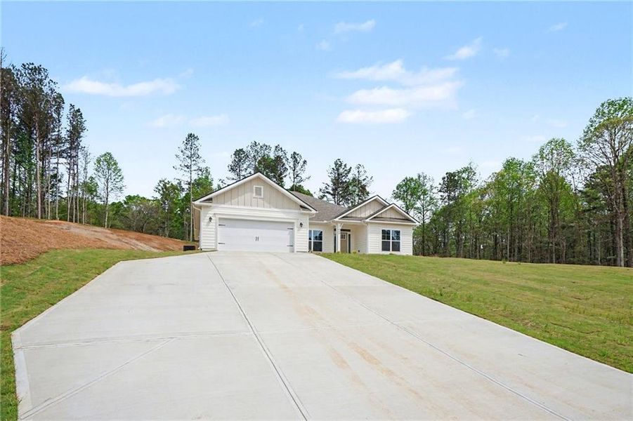 Front exterior of a new home in Eagle Heights, Maysville, GA, highlighting curb appeal (Image 2). Front exterior of a new home in Eagle Heights, Maysville, GA, highlighting curb appeal (Image 2).