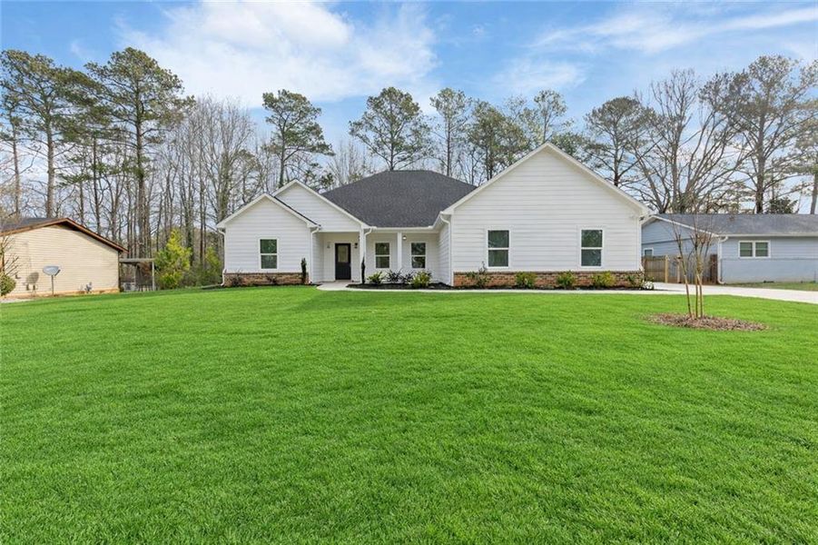 Front exterior of a new home in , Lithonia, GA, highlighting curb appeal (Image 22).