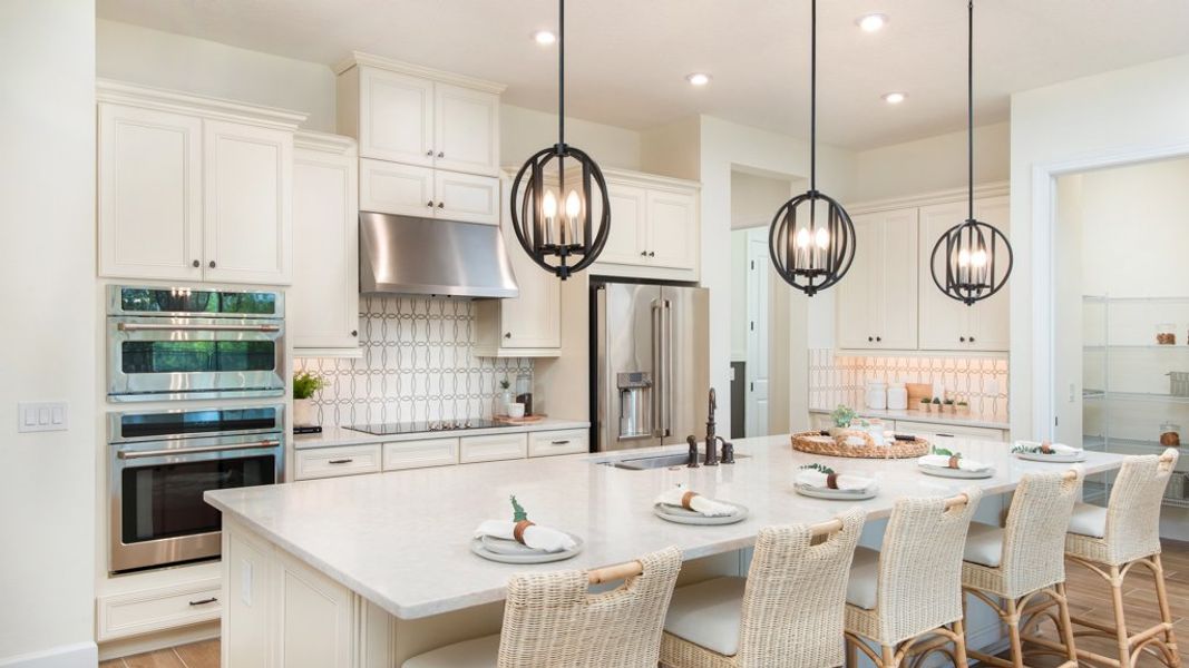Representative furnished interior of a home built from the Ambra by Taylor Morrison in Astor Creek Golf and Country Club, Port St. Lucie (Image 7).