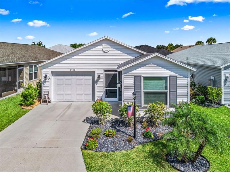 Front exterior of a new home in , The Villages, FL, highlighting curb appeal (Image 25).