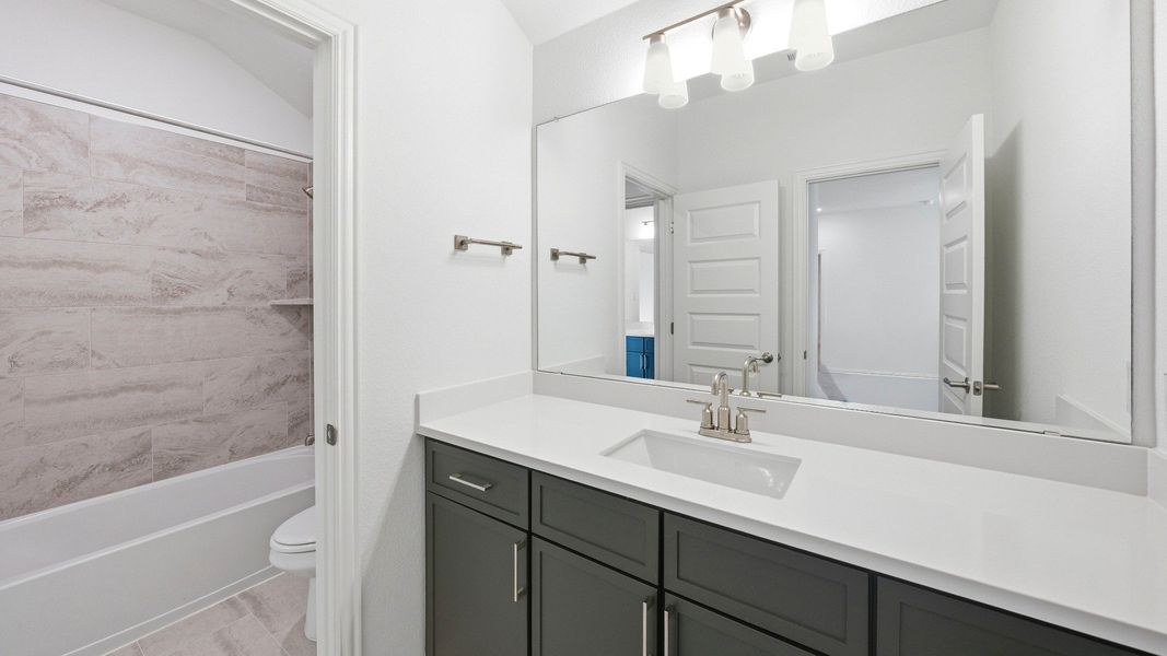 Furnished interior view inside a new home in Oaks at San Gabriel, Georgetown (Image 9).