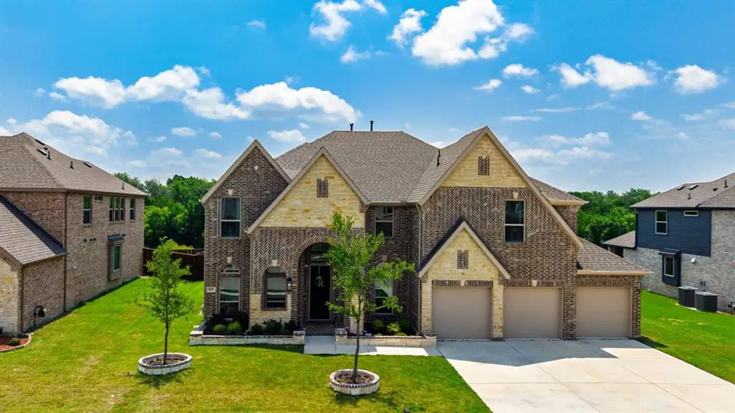 Front exterior of a new home in Grayhawk Addition, Forney, TX, highlighting curb appeal (Image 2).