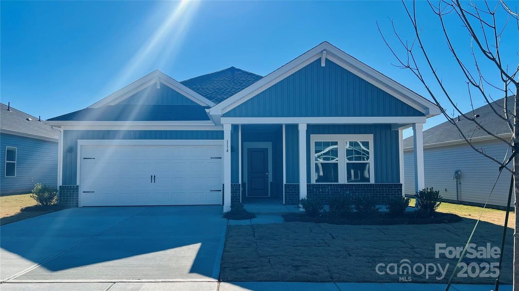 Front exterior of a new home in Oxford Station, Salisbury, NC, highlighting curb appeal (Image 1). Front exterior of a new home in Oxford Station, Salisbury, NC, highlighting curb appeal (Image 1).