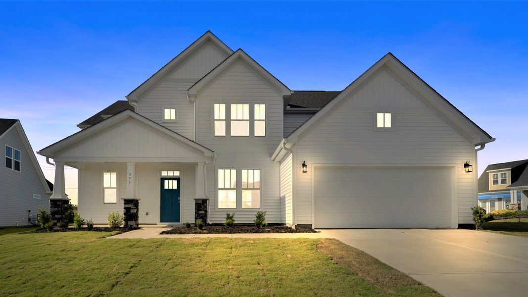 2 story single family home, all white with a 2 car garage