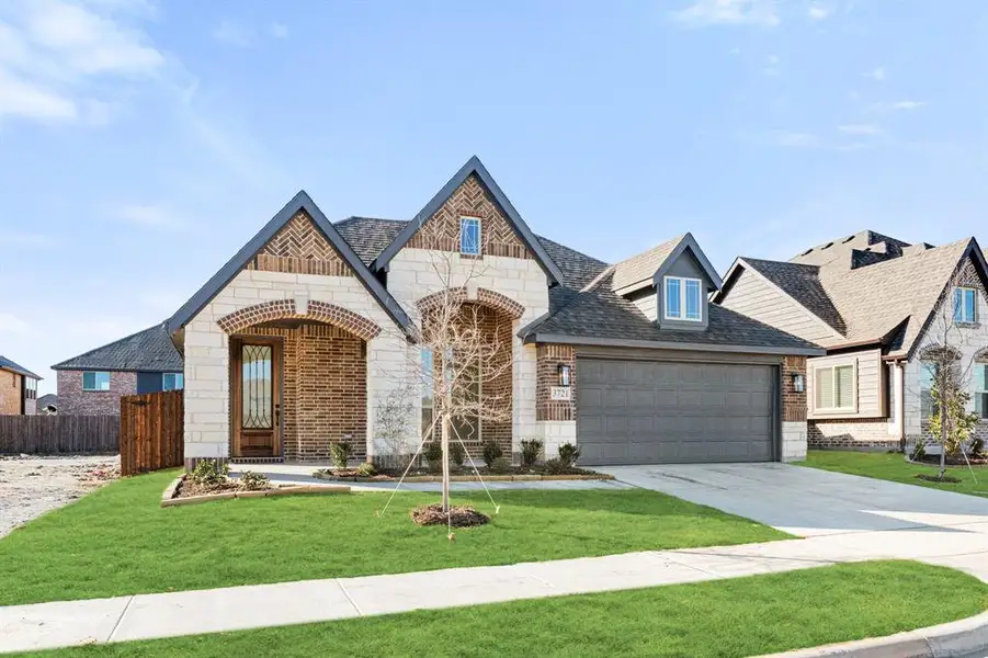 Front exterior of a new home in Georgetown at Kings Fort, Kaufman, TX, highlighting curb appeal (Image 2).