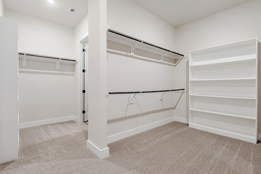 Another angle of the closet with built-in shelving, perfect for organization.