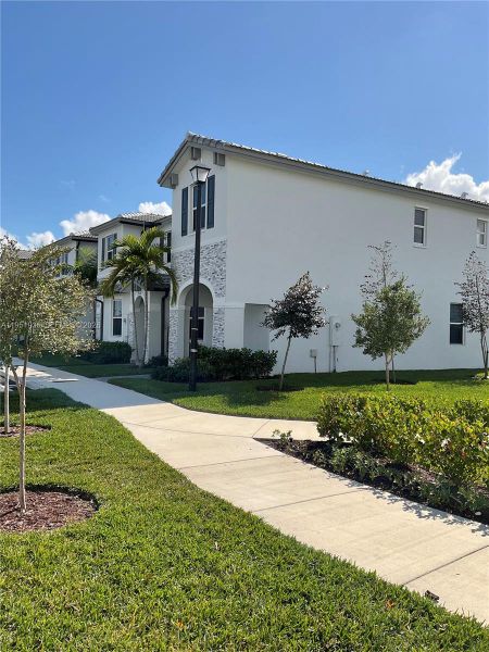 Front exterior of a new home in , Homestead, FL, highlighting curb appeal (Image 22).