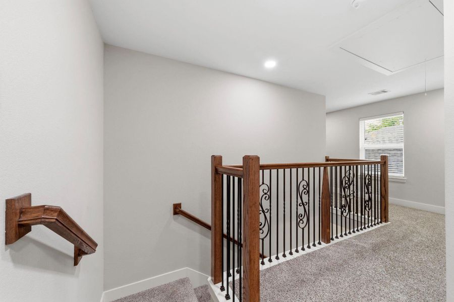 Spacious upstairs landing creates a bright, spacious feel and provides easy access to bedrooms.