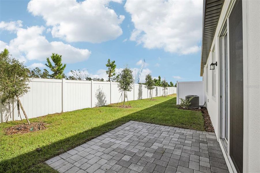 Exterior details and patio area of a home in Cyrene at Minneola - Villas, Minneola (Image 23).