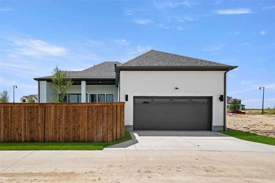 Front exterior of a new home in Walsh Ranch 60', Fort Worth, TX, highlighting curb appeal (Image 1). Front exterior of a new home in Walsh Ranch 60', Fort Worth, TX, highlighting curb appeal (Image 1).