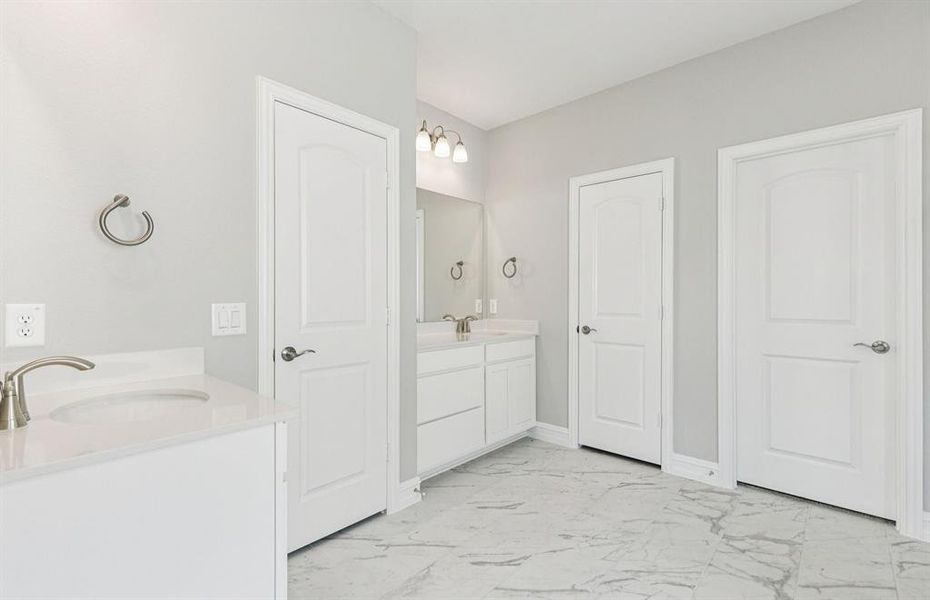 Luxurious owner's bath complete with double sinks
