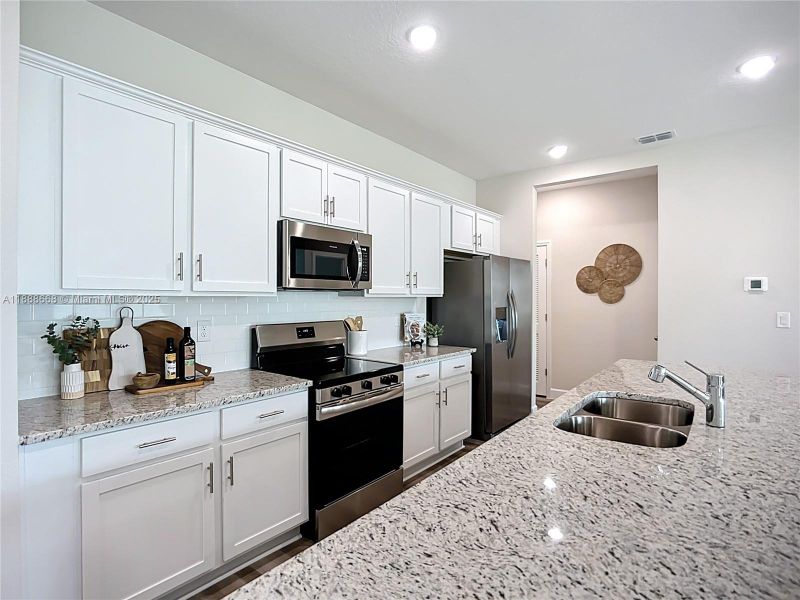 Furnished interior view inside a new home in , North Port (Image 4).