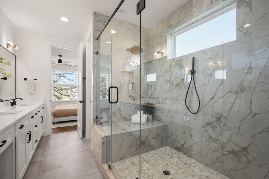 Large walk in shower with bench seating