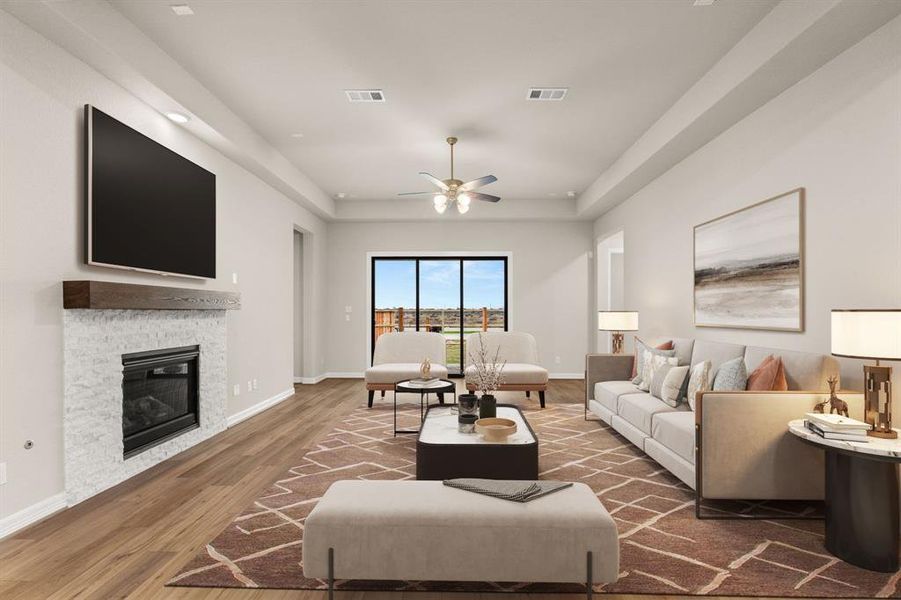 Your family room has ample space to entertain family and friends. This space features beautiful floors, fresh paint, ceiling fan with lighting, and high ceilings.