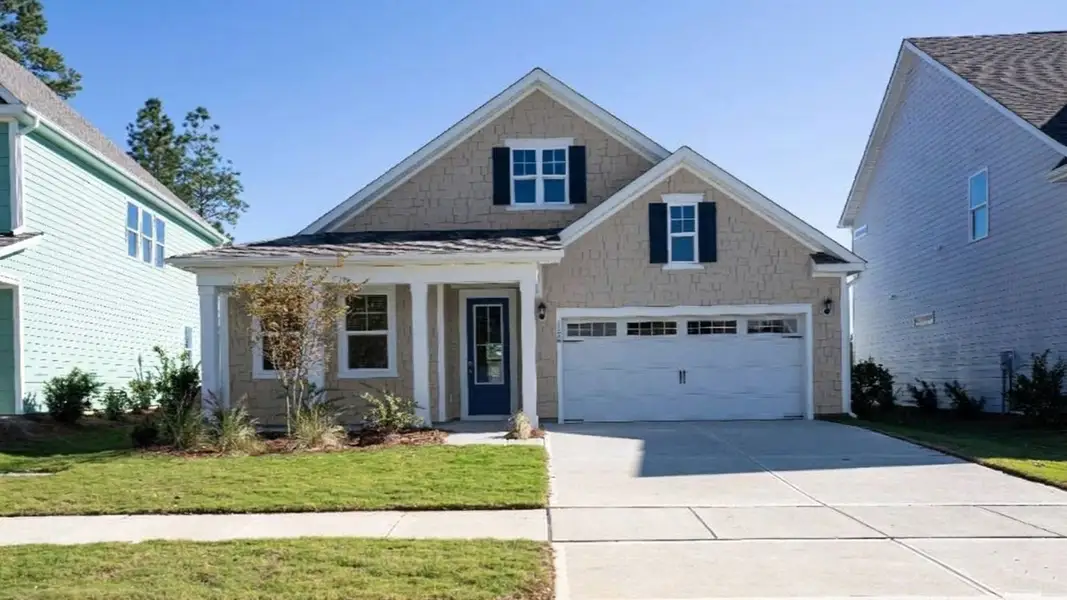 Front exterior of a new home in The Haven at Indigo Preserve, Leland, NC, highlighting curb appeal (Image 1). Front exterior of a new home in The Haven at Indigo Preserve, Leland, NC, highlighting curb appeal (Image 1).