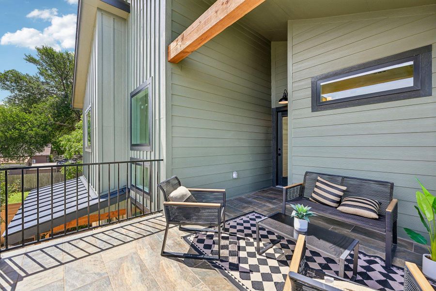 An inviting outdoor terrace with tiled flooring offers a private space for relaxation and enjoyment. An inviting outdoor terrace with tiled flooring offers a private space for relaxation and enjoyment.