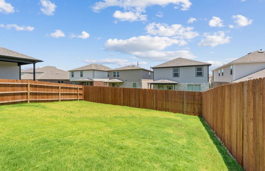 Front exterior of a new home in Saddleback at Santa Rita Ranch, Liberty Hill, TX, highlighting curb appeal (Image 19). Front exterior of a new home in Saddleback at Santa Rita Ranch, Liberty Hill, TX, highlighting curb appeal (Image 19).