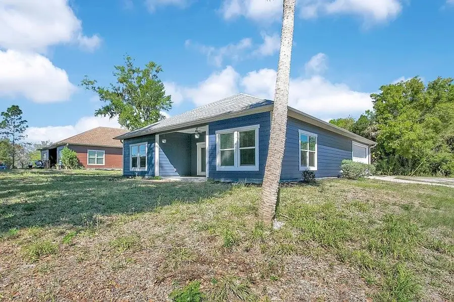 Exterior details and patio area of a home in , Mims (Image 4). Exterior details and patio area of a home in , Mims (Image 4).