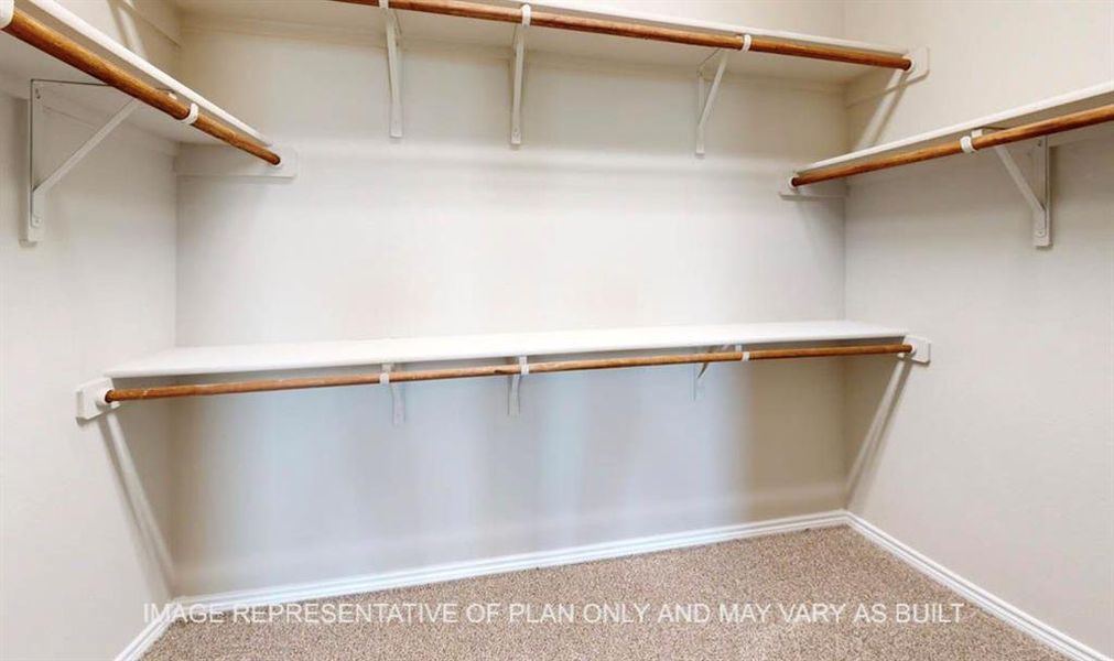 Walk in closet with light carpet Walk in closet with light carpet