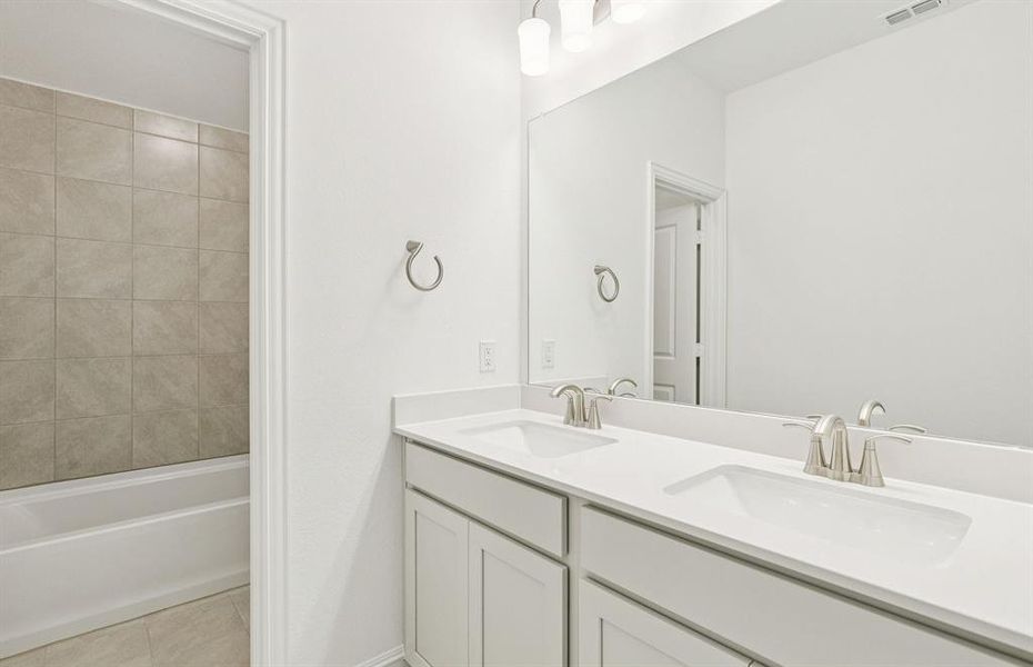 Upgraded secondary bath with double sinks Upgraded secondary bath with double sinks