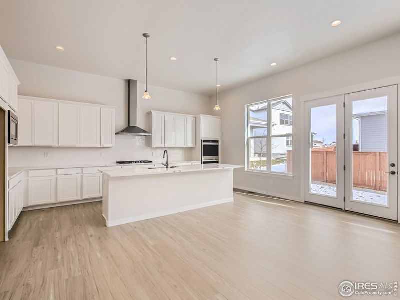 Furnished interior view inside a new home in RainDance, Windsor (Image 8).