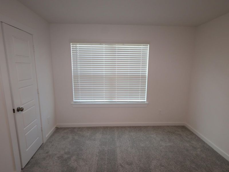 Spacious, unfurnished interior of a new home in Pinewood at Grand Texas, New Caney (Image 14).