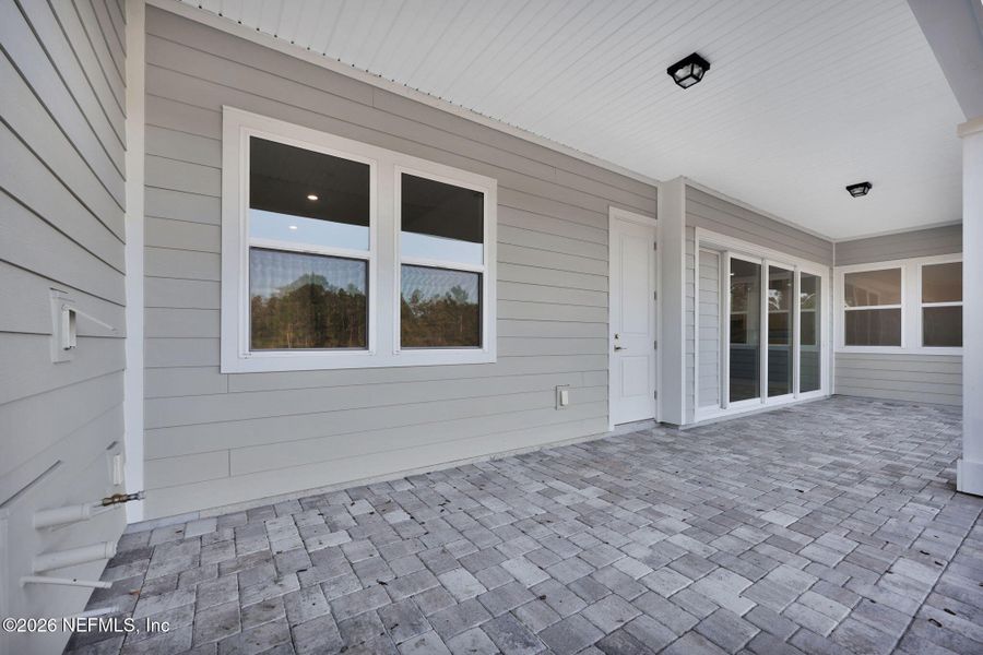 Exterior details and patio area of a home in The Landings at Saint Johns, St. Johns (Image 27).