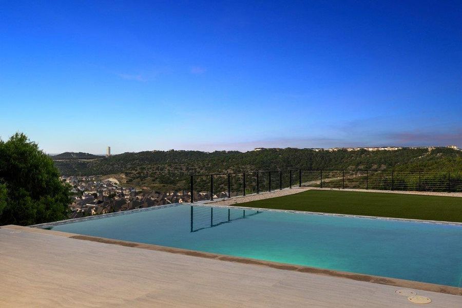 Infinity pool offers captivating views of the surrounding hills and distant cityscape.