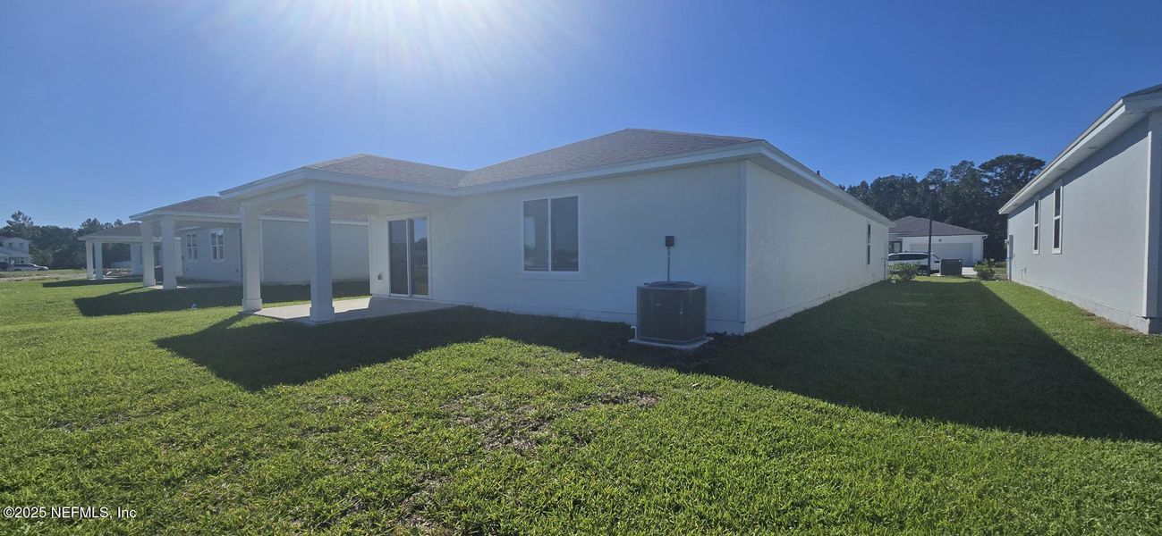 Exterior details and patio area of a home in Lakes at Bella Lago - Signature Series, Green Cove Springs (Image 2). Exterior details and patio area of a home in Lakes at Bella Lago - Signature Series, Green Cove Springs (Image 2).