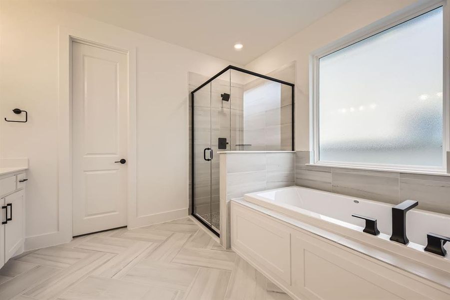 Full bath featuring a bath, a shower stall, vanity, and recessed lighting
