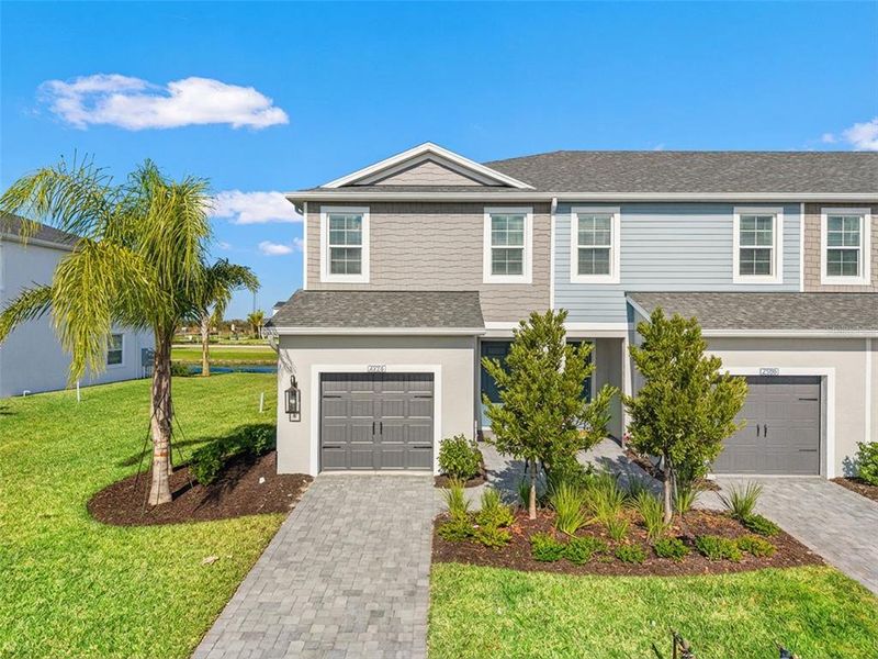Front exterior of a new home in , Bradenton, FL, highlighting curb appeal (Image 21).