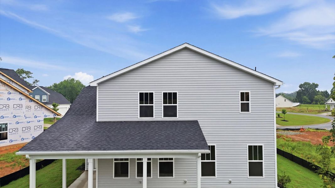 Refined rear exterior with a stylish covered porch for dining, relaxing, or entertaining in Piedmont, SC Refined rear exterior with a stylish covered porch for dining, relaxing, or entertaining in Piedmont, SC