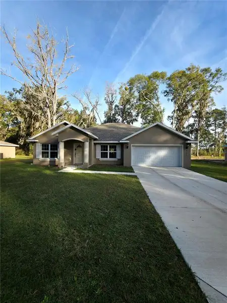 Front exterior of a new home in , Summerfield, FL, highlighting curb appeal (Image 24). Front exterior of a new home in , Summerfield, FL, highlighting curb appeal (Image 24).