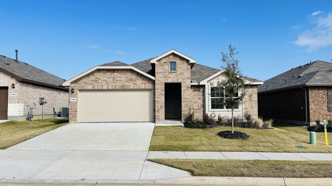 Representative exterior photo of a completed home built from the KENNEDY by D.R. Horton in Saratoga, Granbury, TX (Image 1).