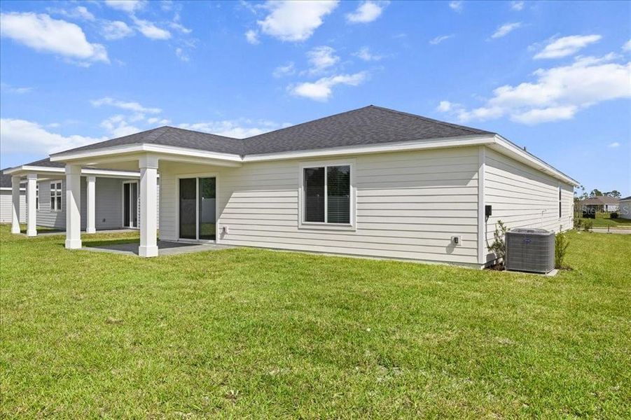 Exterior details and patio area of a home in Colbert Landings, Palm Coast (Image 4).