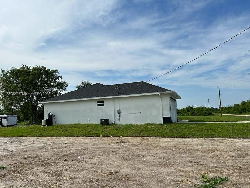 Exterior details and patio area of a home in , Lehigh Acres (Image 10). Exterior details and patio area of a home in , Lehigh Acres (Image 10).
