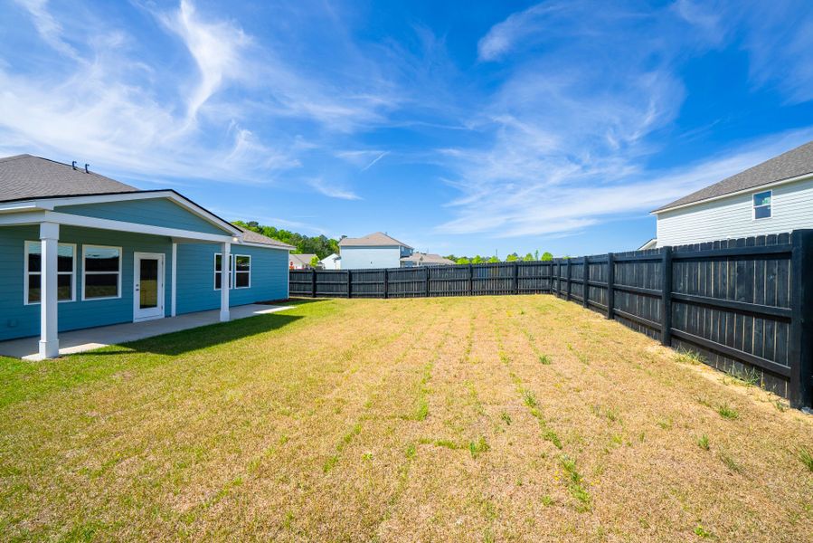Exterior details and patio area of a home in Monroe Preserve, Chapin (Image 28).