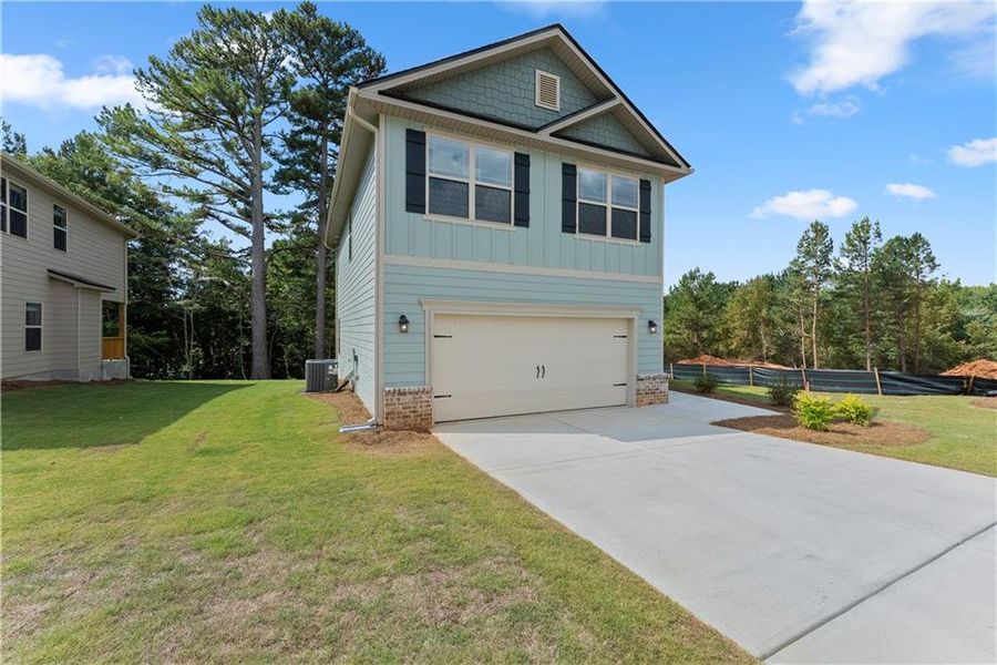 Front exterior of a new home in Magnolia Villas, Cornelia, GA, highlighting curb appeal (Image 25). Front exterior of a new home in Magnolia Villas, Cornelia, GA, highlighting curb appeal (Image 25).