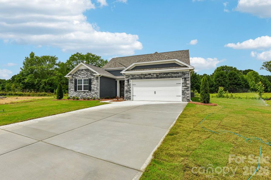 Front exterior of a new home in Sanctuary at Southgate, Indian Trail, NC, highlighting curb appeal (Image 16).