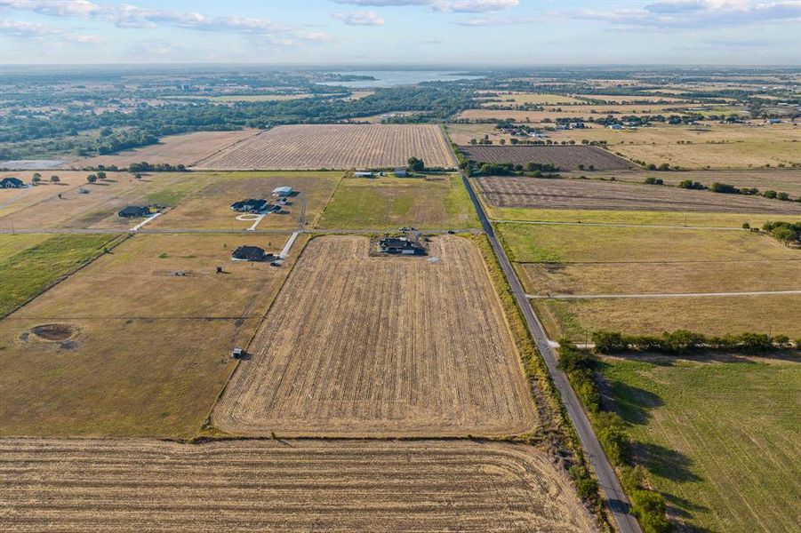 Aerial view of sparsely populated area featuring abundant farmland