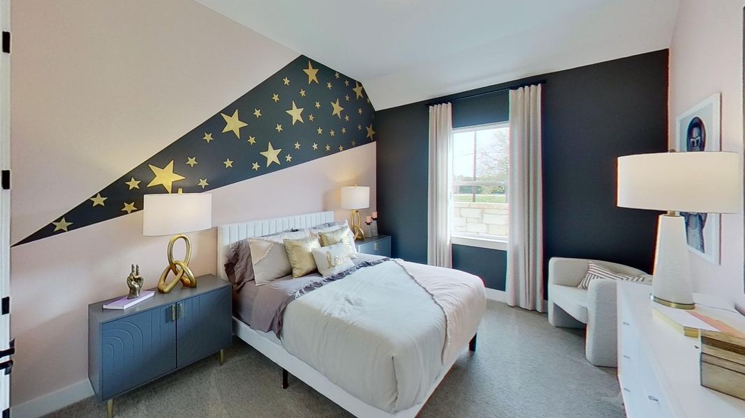 Bedroom with an accent wall, carpet floors, and wallpapered walls