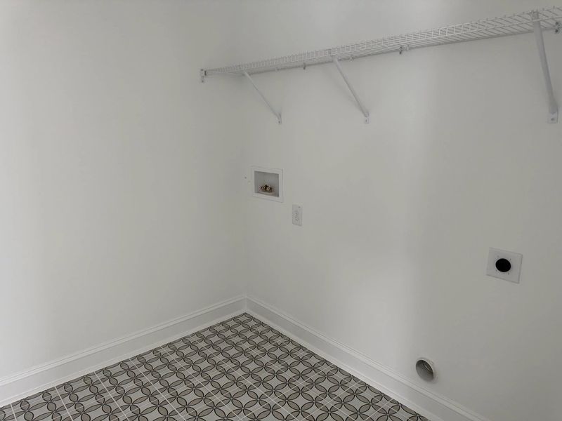 Laundry Room featuring the AW Collection® Coastal - Bright space with wire shelving for ease. Laundry Room featuring the AW Collection® Coastal - Bright space with wire shelving for ease.