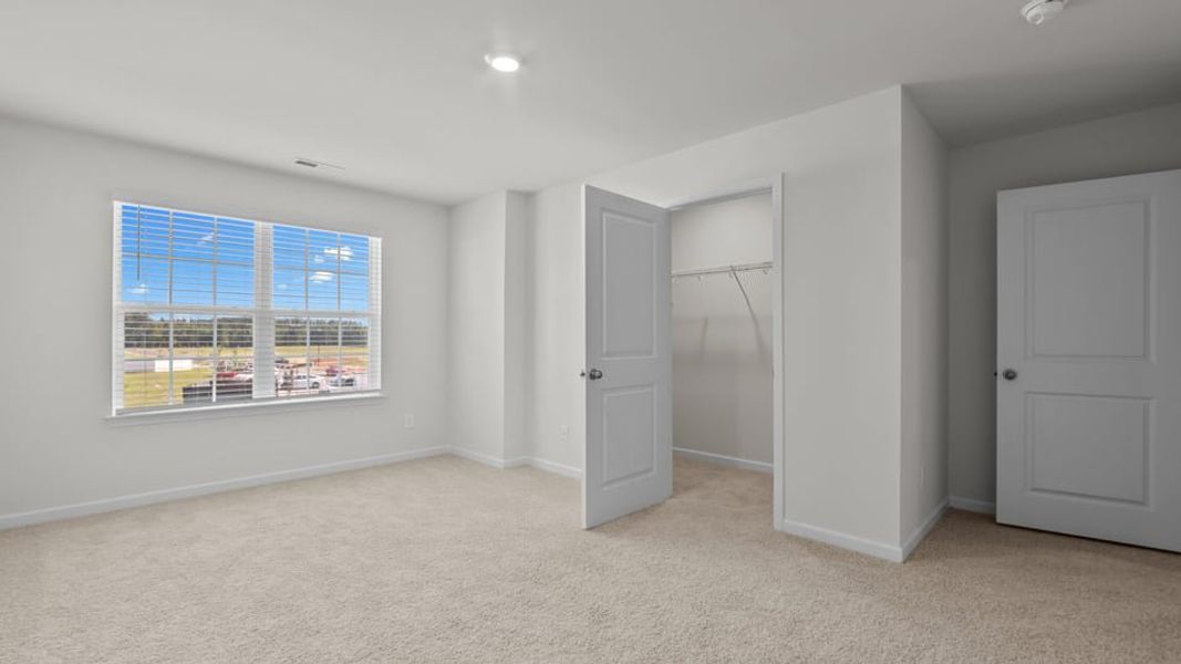 Spacious, unfurnished interior of a new home in The Townes at Ridgewood Farms, Winterville (Image 25).