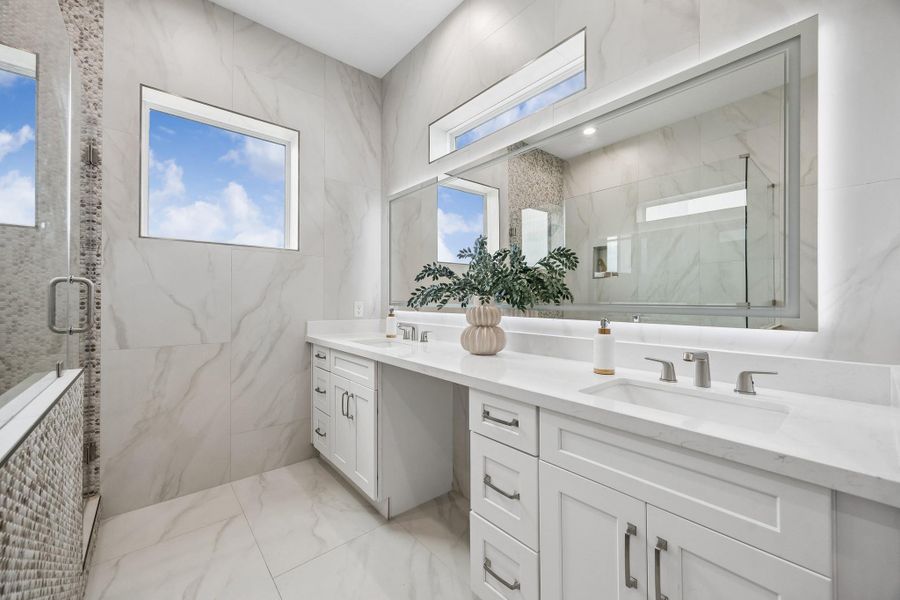 Luxe finishes, quartz counters and dual vanities are featured in the primary bath. Luxe finishes, quartz counters and dual vanities are featured in the primary bath.