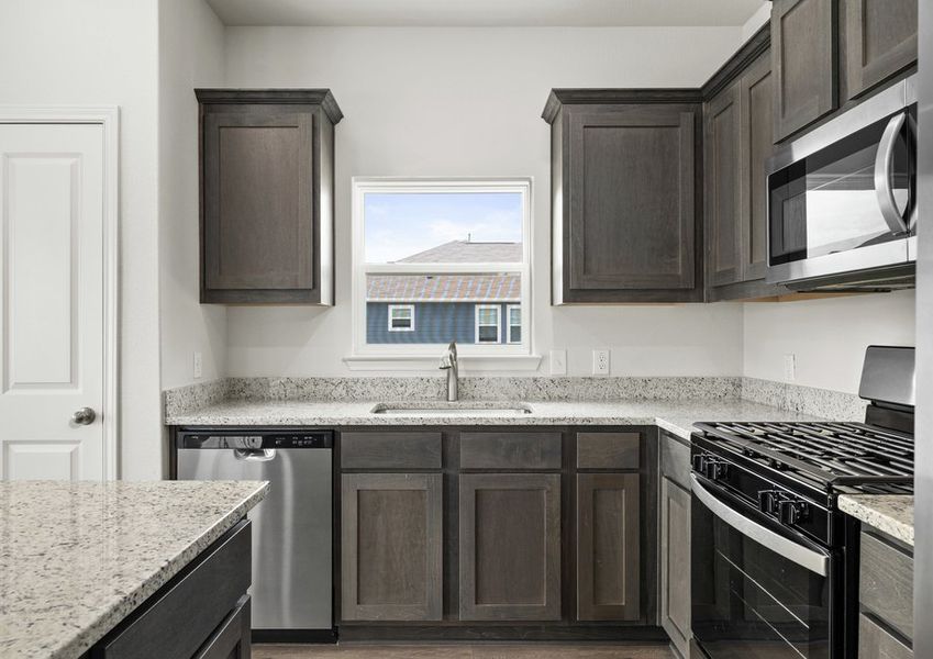 The kitchen has a large window that lets in great, natural light.