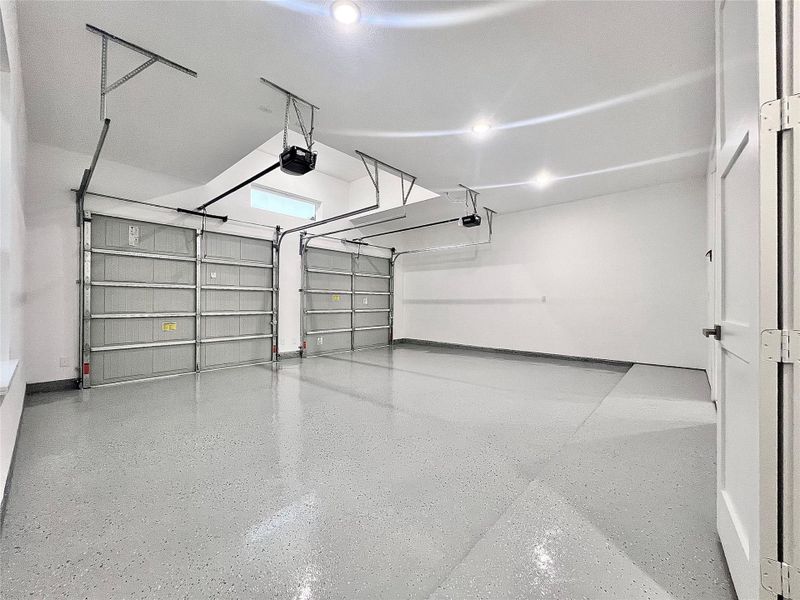 Large 24'X 22 Epoxy Garage Floors with 10' Ft. Ceiling Height, 3 white light LED can lights, Garage Door Openers and Tandem Window above Garage Doors, give this Garage a Gym-like feel. Large 24'X 22 Epoxy Garage Floors with 10' Ft. Ceiling Height, 3 white light LED can lights, Garage Door Openers and Tandem Window above Garage Doors, give this Garage a Gym-like feel.